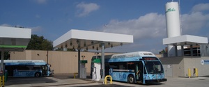 2 hydrogen fuel cell buses at the fueling station.