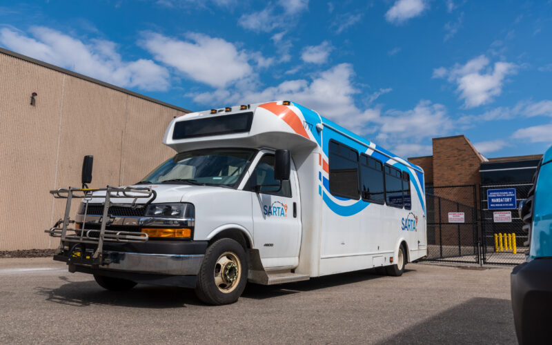 This is an image of a SARTA paratransit bus parked outside of SARTA's bus garage.